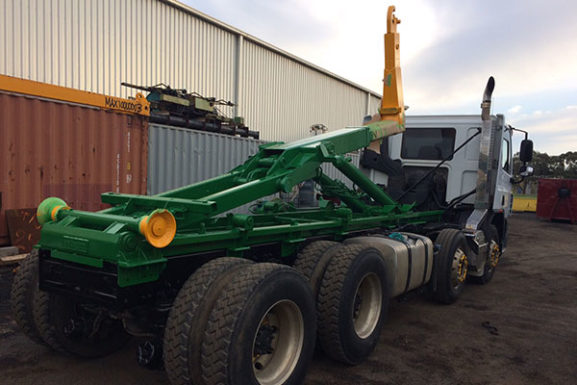 Hyva 16/53 Hook Lift Supplied To WM Waste Management Services, Fitted With A Hyva Roll Rite Tarp System And Painted In WM Waste Company Colours.