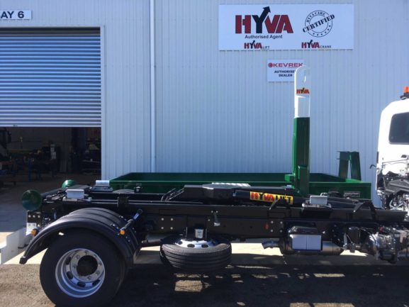 Hyva 9 tonne Hook Lift, fitted to a Hino 1426. Painted in company colours, fitted with load cells, toolbox and beacons.