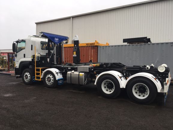 Pictured is a Hyva 20-57 Hooklift fitted to an Isuzu 8×4 cab chassis. This was our very first to be fitted with the new Hyva Tarp System.